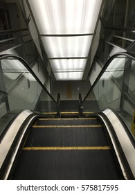 Empty escalator that forms interesting lines and perspective.