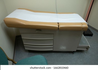 Empty Exam Table With Protective Paper