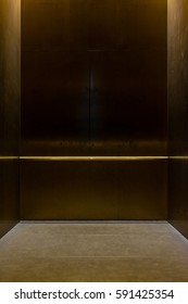 Empty Fancy Elevator Carriage Metal Pole Inside Metal Box Interior Closed Elegant Gold Bronze Overhead Floor Trap Blank Room