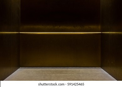 Empty Fancy Elevator Carriage Metal Pole Inside Metal Box Interior Closed Elegant Gold Bronze Overhead Floor Trap Blank Room