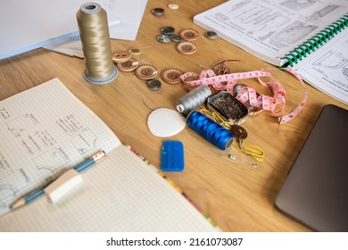 Empty Fashion Atelier Of Designer Or Seamstress With Threads And Sewing Machine On Table. No People In Own Stylish Workshop Of Tailor Or Dressmaker. Clothing Garment Design. Style And Dressmaking.