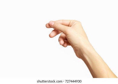 Empty female hand making gesture like holding something isolated at white background.