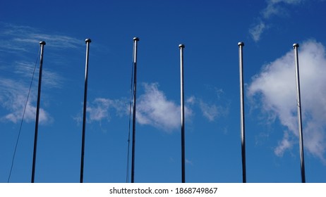 empty flagpoles against sky background