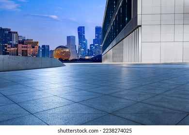 Empty floor and modern city skyline with building at sunrise in Hangzhou, China.  - Powered by Shutterstock