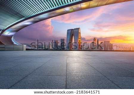 Photo of Empty floor and modern city skyline with building at sunset in Suzhou, China. high angle view.
