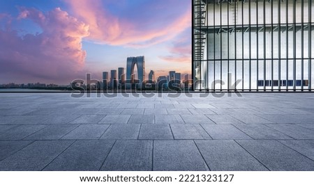 Empty floor and modern city skyline with building at sunset in Suzhou, China. 