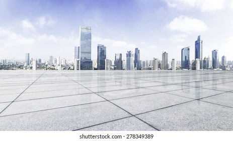 Empty floor with modern skyline and buildings