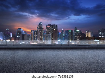 Empty floor platform with night view city skyline background - Shutterstock ID 765381139