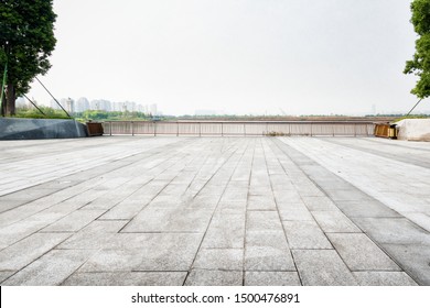 Empty floor square and playground ferris wheel in the city park - Powered by Shutterstock