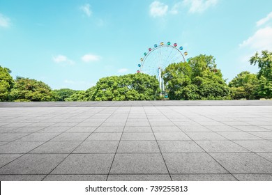 Empty Floor Square And Playground Ferris Wheel In The City Park