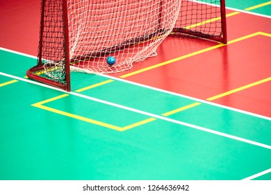 Empty Floorball goal with the ball in the net. Floor in the sports hall designed for sports - Powered by Shutterstock