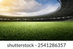 Empty football stadium with green field and blue sky. The field is ready for a game. Concept of Professional sport, Competition, Championship and match. Soccer stadium field background