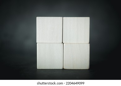 Empty Four Wooden Blocks Stacked In Two Rows Combined Into A Big Square On A Black Background