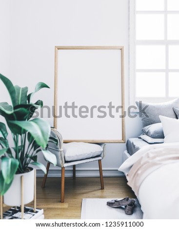 Empty frame in interior. Poster mockup in bedroom.