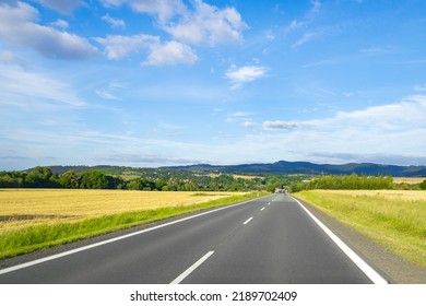 Empty Freeway Goes Into The Distance On A Summer Day