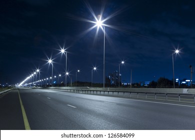 Empty freeway at night - Powered by Shutterstock