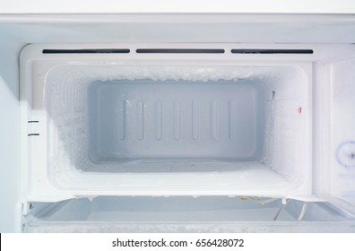 Empty Freezer Of A Refrigerator - Ice Buildup On The Inside Of A Freezer Walls. 