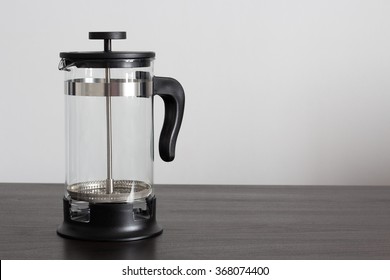 Empty French Press On A Wooden Table