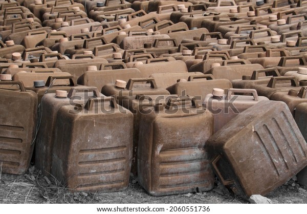 empty fuel cans. the\
concept of the rise in price of petroleum products. barrels for\
gasoline. oil tanks