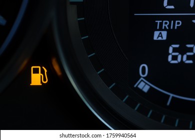 Empty Fuel Warning Light In Car Dashboard. Fuel Pump Icon. Gasoline Gauge Dash Board In Car With Digital Warning Sign Of Run Out Of Fuel Turn On. Low Level Of Fuel Show On Speedometer Dashboard.