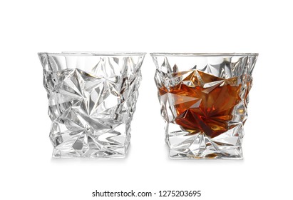 Empty And Full Whiskey Glasses On White Background