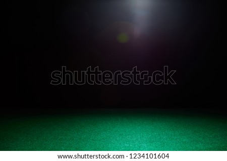 Empty gambling table in green colors. Light effect.