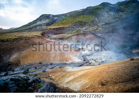 Empty geothermal Krysuvik area on Reykjanes peninsula in Iceland on early summer morning. Visible sulphur rising from the ground.