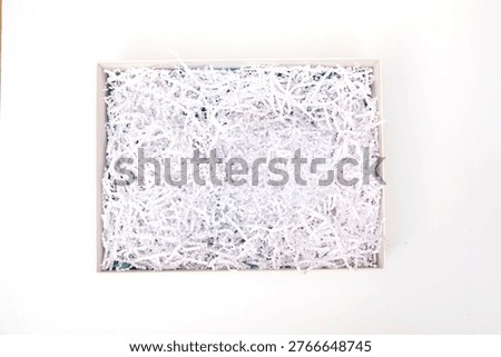 An empty gift box filled with blank paper slips, designed for customizable messages or surprise notes. A versatile and minimal concept perfect for gifting, ideas, wishes, or interactive presentation use