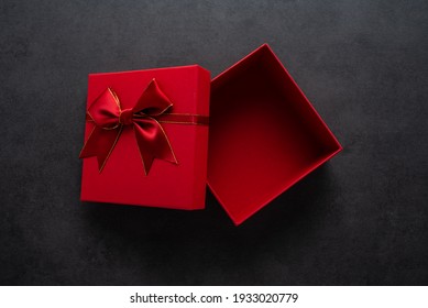 An empty gift box on a black background - Powered by Shutterstock