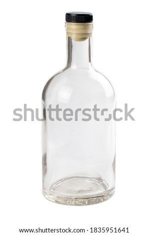 Empty glass bottle isolated on a white background. Bottle for alcohol. Clear bottle. Front view