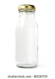 Empty Glass Bottle Of Milk With Golden Cap Isolated On White Background