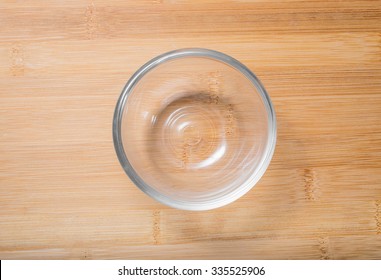 Empty Glass Bowl On Wooden Table Top View