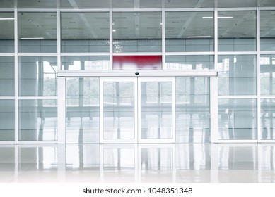 Empty Glass Door In Office Building With Copy Space