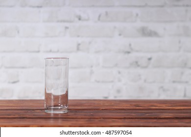 Empty Glass On The Dark Wooden Table In Cafe