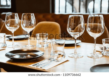 empty glass on dining table set - selective focus point