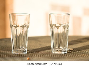 Empty Glass  Standing On The Wooden Table