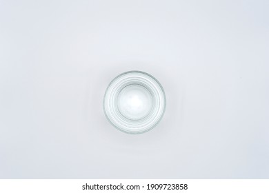 Empty Glass Tumbler Viewed From Above On White Background.