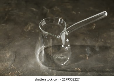 Empty Glass Turkish Coffee Pot On Grey Table