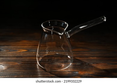 Empty Glass Turkish Coffee Pot On Wooden Table