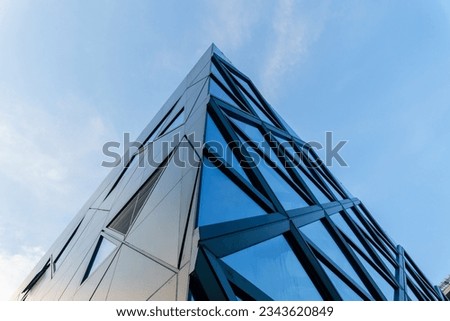 empty glass windows of modern building exterior with sky for copy spcae.