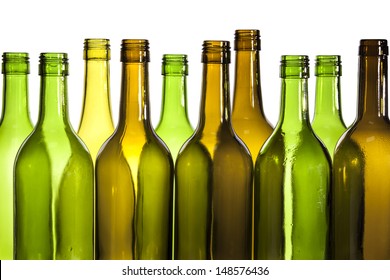 Empty glass wine bottles, washed and ready for recycling.