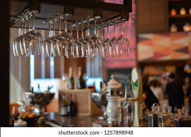 Empty glasses await customers in the bar. - Powered by Shutterstock