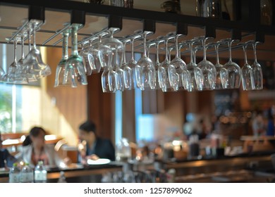 Empty glasses await customers in the bar. - Powered by Shutterstock