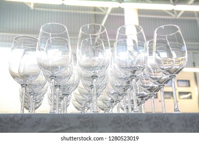 Empty glasses on the table in a large hangar
