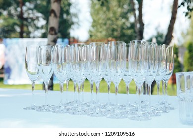 empty glasses on the white table. champagne glasses. 