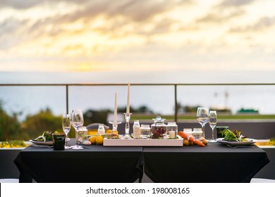 Empty Glasses Set In Restaurant - Dinner Table Outdoors At Sunset 