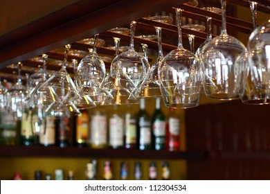 Empty Glasses For Wine Above A Bar Rack