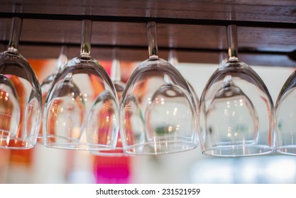 Empty Glasses For Wine Above A Bar Rack