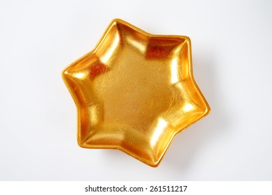 Empty Gold Star Bowl On White Background