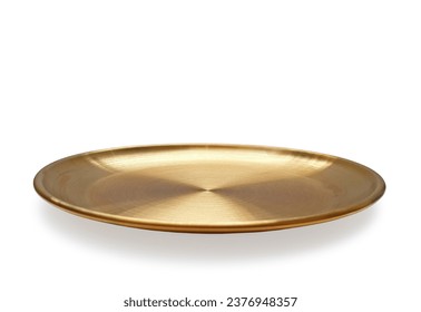 Empty golden plate isolated on white background with clipping path. Front view of gold round flat plate with shadow. Mock up template for food poster design.